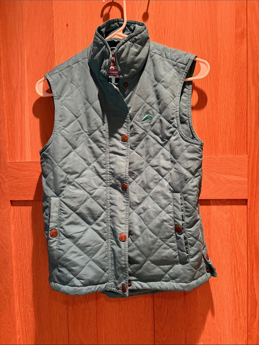 Woman’s turquoise riding sport riding vest